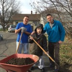Devin Land, John Olson, and Eric Plaut work in the yard at one of L'Arche Clinton's homes.