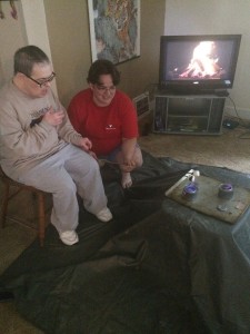 Sara Ellet and John Olsen find a light in the darkness by roasting marshmallows indoors. Photo by Sara Ellet